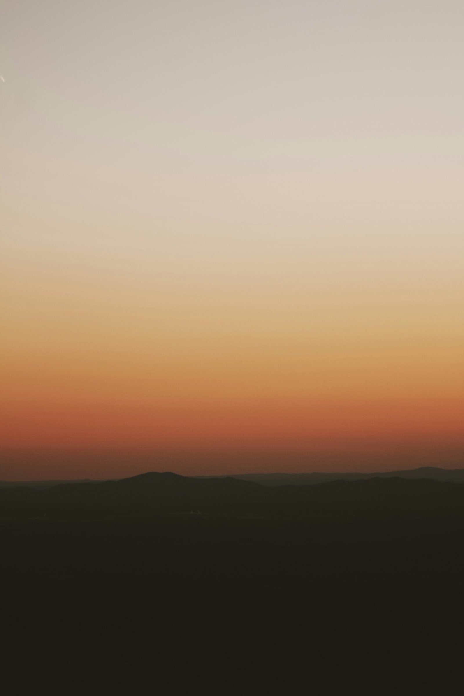 silhouette of mountain during sunset